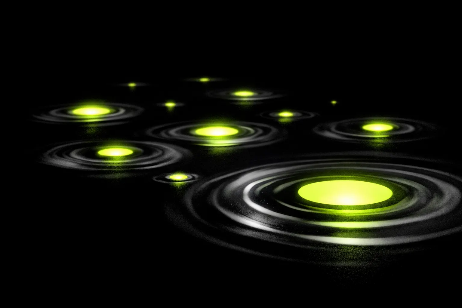 A cluster of small new pools appears unstable, with ripples spreading quickly across a dark background.